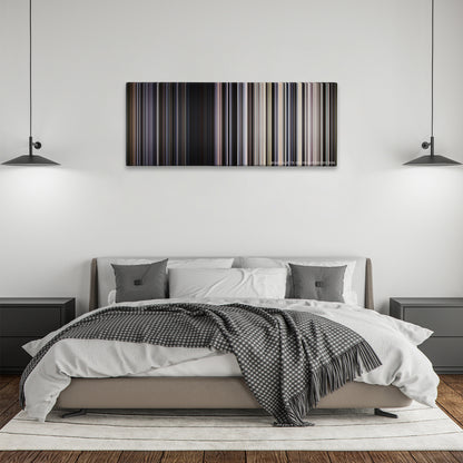Transcendence color palette canvas above a bed, between two black pendant lamps