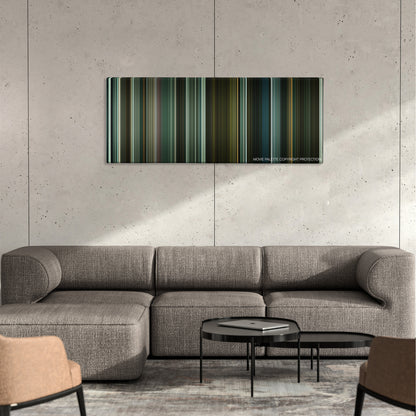 Harry Brown color palette canvas on a concrete wall above a gray sectional sofa