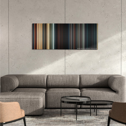 The Mummy color palette canvas on a concrete wall above a gray sectional sofa