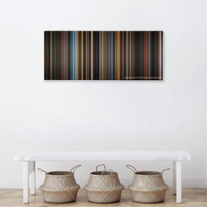 Confessions of a Dangerous Mind color palette canvas above a white bench with three woven baskets
