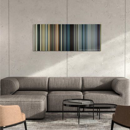 The Expendables 3 color palette canvas on a concrete wall above a gray sectional sofa