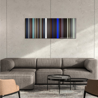25th Hour color palette canvas on a concrete wall above a gray sectional sofa