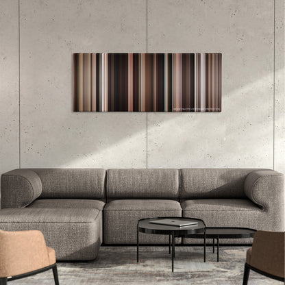 Stuck in Love. color palette canvas on a concrete wall above a gray sectional sofa