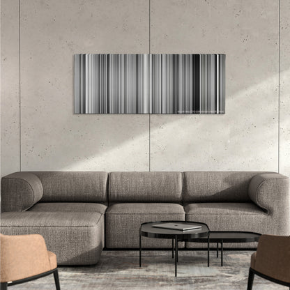Pi color palette canvas on a concrete wall above a gray sectional sofa