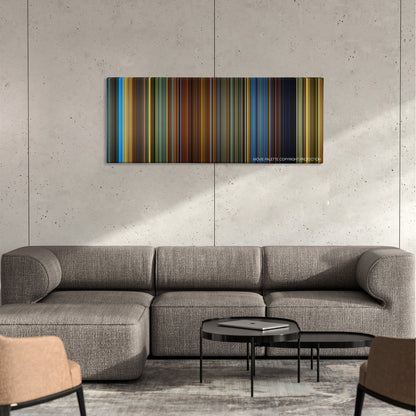 Haywire color palette canvas on a concrete wall above a gray sectional sofa