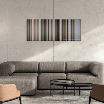 Goon color palette canvas on a concrete wall above a gray sectional sofa