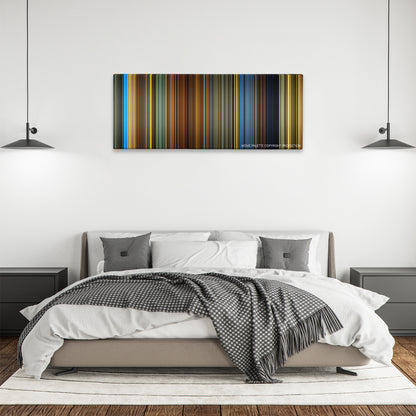 Haywire color palette canvas above a bed, between two black pendant lamps