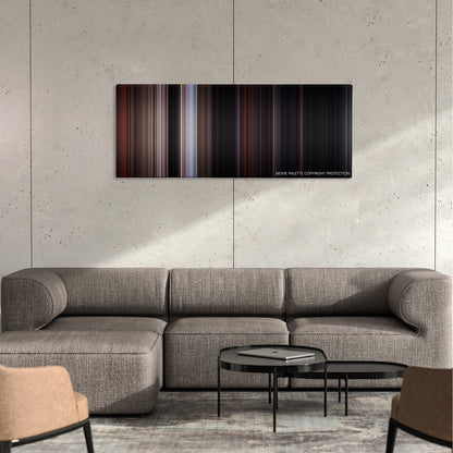 Rebel Without a Cause color palette canvas on a concrete wall above a gray sectional sofa