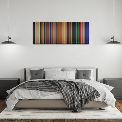 Ghostbusters color palette canvas above a bed, between two black pendant lamps