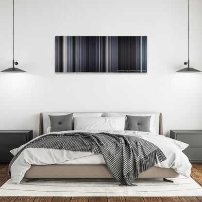 Martyrs color palette canvas above a bed, between two black pendant lamps