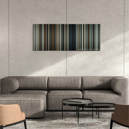Snitch color palette canvas on a concrete wall above a gray sectional sofa