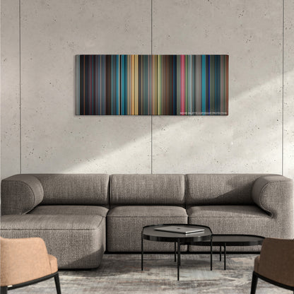 Surrogates color palette canvas on a concrete wall above a gray sectional sofa