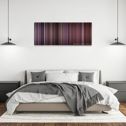 Secretary color palette canvas above a bed, between two black pendant lamps