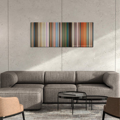 Cashback color palette canvas on a concrete wall above a gray sectional sofa