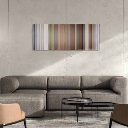 Planet of the Apes color palette canvas on a concrete wall above a gray sectional sofa