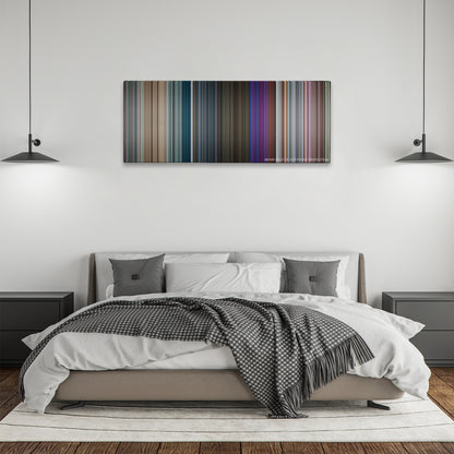 Closer color palette canvas above a bed, between two black pendant lamps