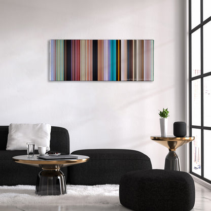 Ice Age color palette canvas above a black sofa with a gold-topped table