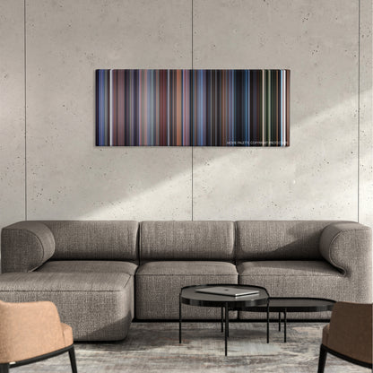 The Frighteners color palette canvas on a concrete wall above a gray sectional sofa