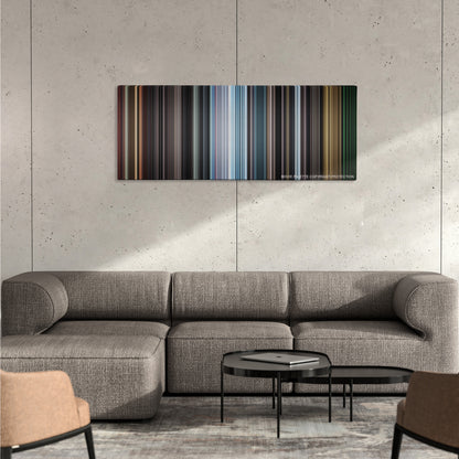 REC color palette canvas on a concrete wall above a gray sectional sofa