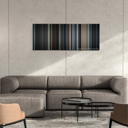 Addams Family Values color palette canvas on a concrete wall above a gray sectional sofa