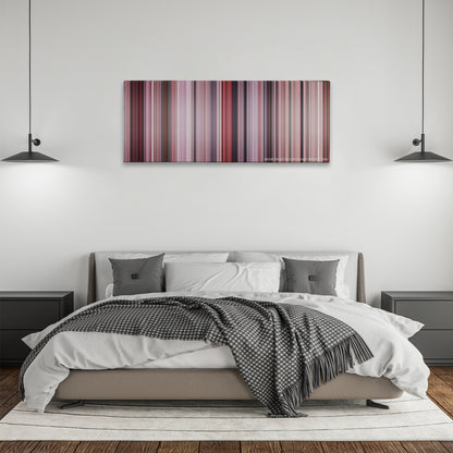 Big color palette canvas above a bed, between two black pendant lamps