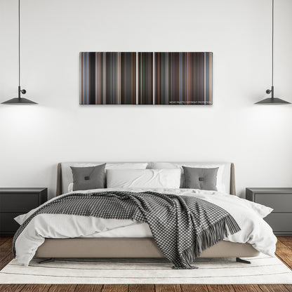 Finding Forrester color palette canvas above a bed, between two black pendant lamps