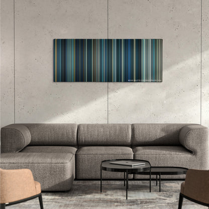 Independence Day: Resurgence color palette canvas on a concrete wall above a gray sectional sofa