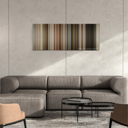 Short Term 12 color palette canvas on a concrete wall above a gray sectional sofa