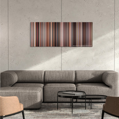 The Change-Up color palette canvas on a concrete wall above a gray sectional sofa