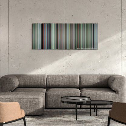 The Tree of Life color palette canvas on a concrete wall above a gray sectional sofa
