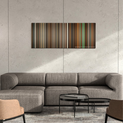 Blitz color palette canvas on a concrete wall above a gray sectional sofa