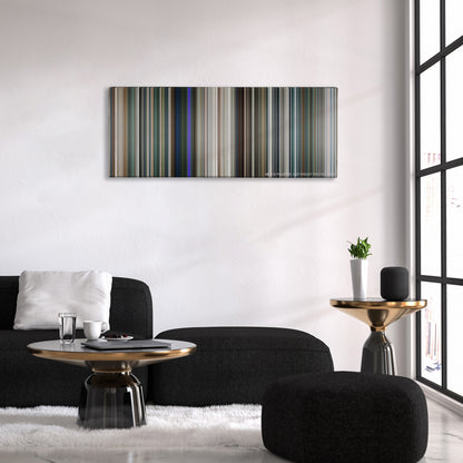 Elysium color palette canvas above a black sofa with a gold-topped table
