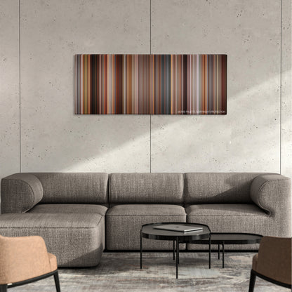 Talk To Her color palette canvas on a concrete wall above a gray sectional sofa