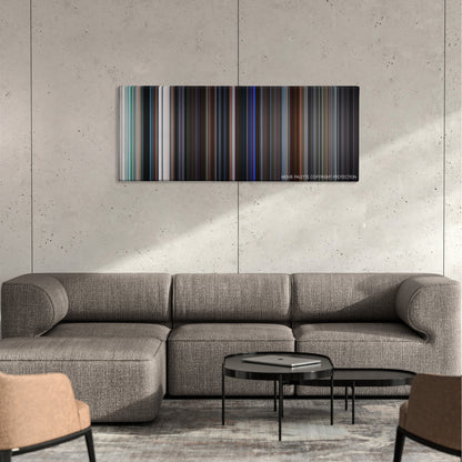 Taking Lives color palette canvas on a concrete wall above a gray sectional sofa