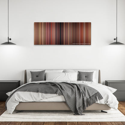 Flipped color palette canvas above a bed, between two black pendant lamps