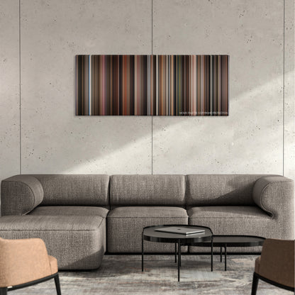 Frida color palette canvas on a concrete wall above a gray sectional sofa