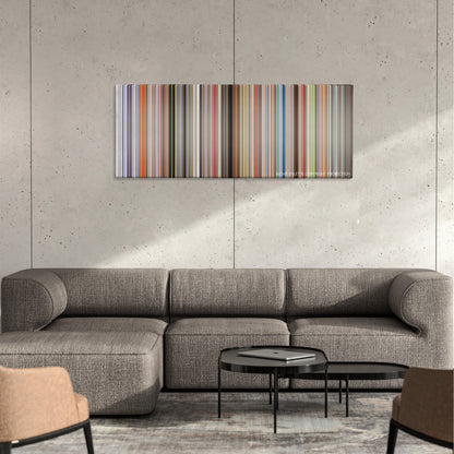 Jackass: The Movie color palette canvas on a concrete wall above a gray sectional sofa