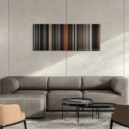 A Monster Calls color palette canvas on a concrete wall above a gray sectional sofa