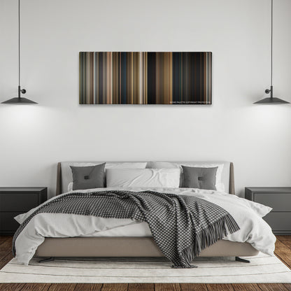 Tomb Raider color palette canvas above a bed, between two black pendant lamps