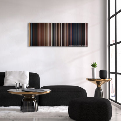 The Wolverine color palette canvas above a black sofa with a gold-topped table