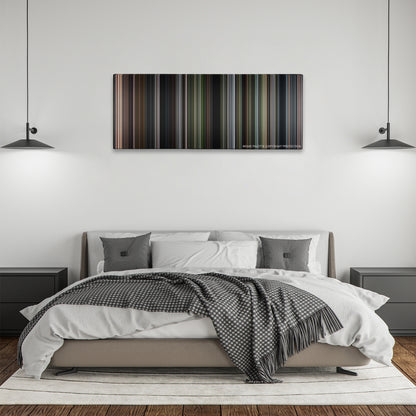 After Earth color palette canvas above a bed, between two black pendant lamps