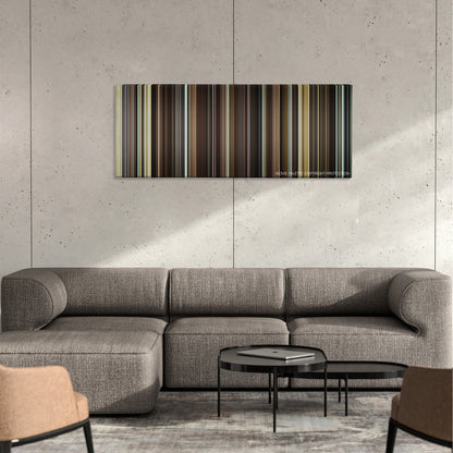 The Great Beauty color palette canvas on a concrete wall above a gray sectional sofa