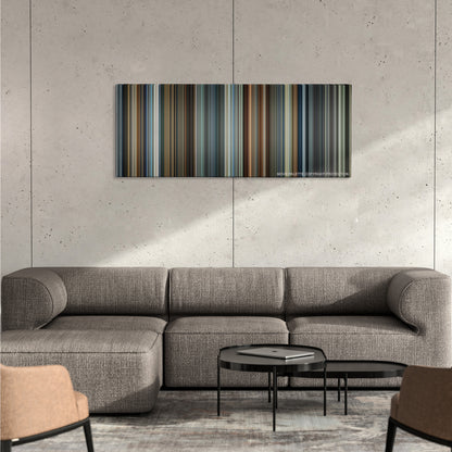 Hitman color palette canvas on a concrete wall above a gray sectional sofa