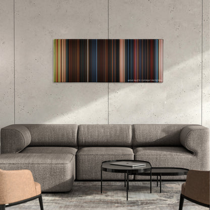 Goosebumps color palette canvas on a concrete wall above a gray sectional sofa