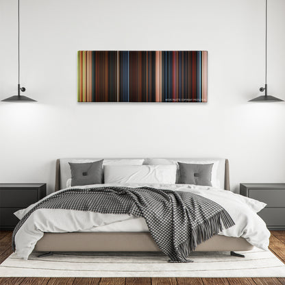 Goosebumps color palette canvas above a bed, between two black pendant lamps