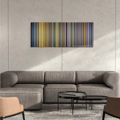 American Made color palette canvas on a concrete wall above a gray sectional sofa