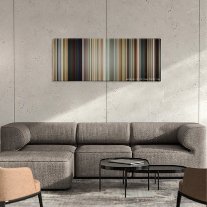 Dope color palette canvas on a concrete wall above a gray sectional sofa