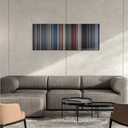 Demolition Man color palette canvas on a concrete wall above a gray sectional sofa