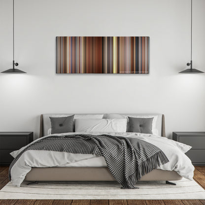Sideways color palette canvas above a bed, between two black pendant lamps