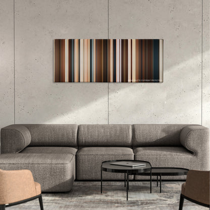 The Searchers color palette canvas on a concrete wall above a gray sectional sofa